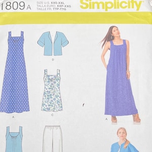 May include: Simplicity sewing pattern 1809A, featuring illustrations of various dress and top designs. The pattern includes a blue polka dot dress, a floral print dress, a solid blue dress, a jacket, and pants. The pattern is for sizes XXS-XXL.