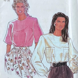 May include: A vintage Simplicity sewing pattern titled "It's So Easy." The pattern features illustrations of two women wearing blouses and skirts. The pattern number is 9838, size 10-20. The cover is white with pink and black text.