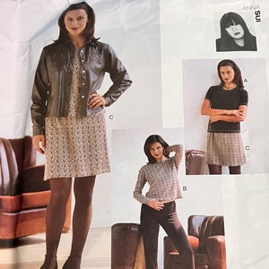 May include: A sewing pattern for a dress and pants. The pattern is for sizes 6, 8, and 10. The pattern is from Vogue Attitudes and is designed by Anna Sui.