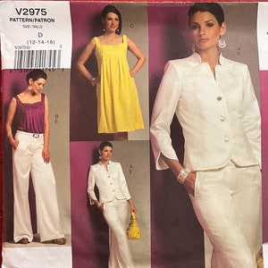 May include: A sewing pattern for a white blazer, white pants, a yellow sleeveless dress, a white blouse with a purple skirt, and a white blouse with a purple skirt. The pattern is from Vogue Wardrobe and is size 12-14-16.