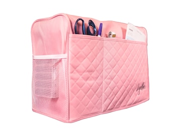 May include: Pink quilted storage bag with three compartments and a mesh pocket. The bag has a white zipper and the word "Lyndier" is printed on the side.