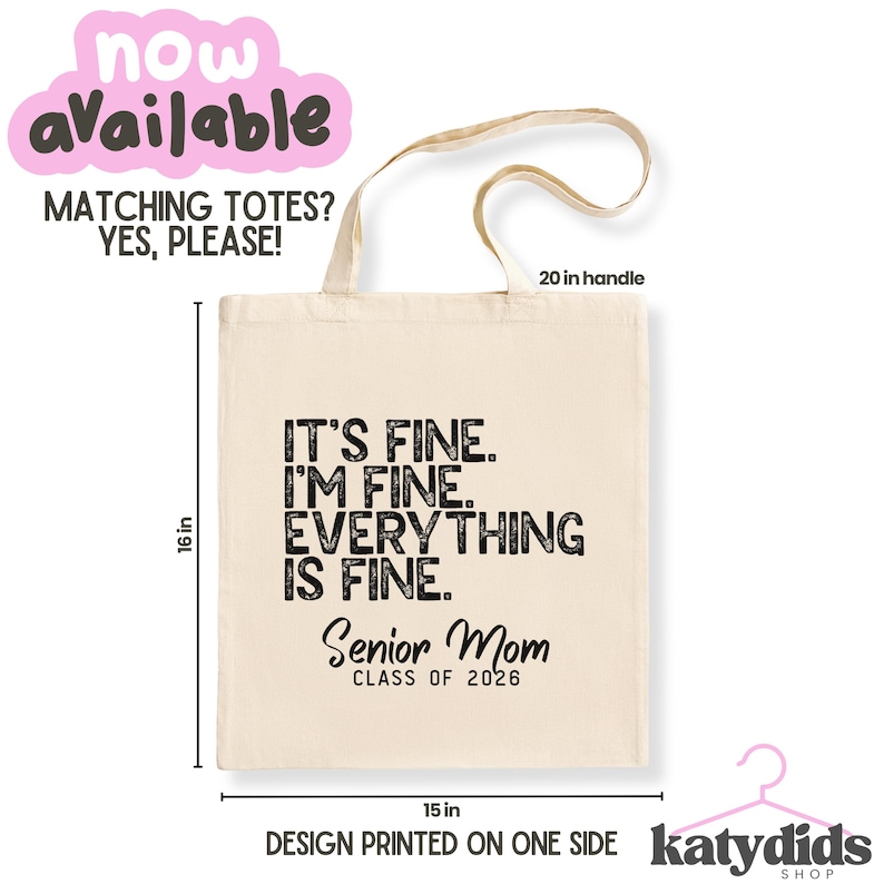 May include: Cream tote bag with black text: "IT'S FINE. I'M FINE. EVERYTHING IS FINE." and "Senior Mom CLASS OF 2026." The bag is 40.6 cm tall and 38.1 cm wide, with a 50.8 cm handle. The design is printed on one side.