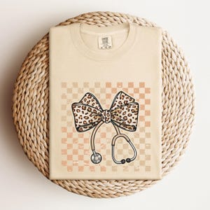 Nurse Leopard Bow T-Shirt, Stethoscope Bow Shirt, Nurse Checkered Shirt, Gift for Nurse, Healthcare Professionals Shirt, Nurse Appreciation