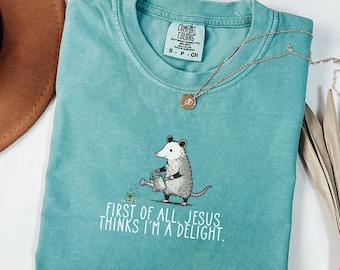 First Of All Jesus Thinks I'm A Delight Shirt, Christian Humor Tee, Funny Faith Gift for Her, Comfort Colors Cute Opossum Christian Shirt