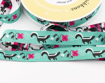 Skunk Smelling the Flowers on Turquoise Background Jacquard Ribbon - 7/8-inch wide (22 mm) - 1 yard, 20 inches