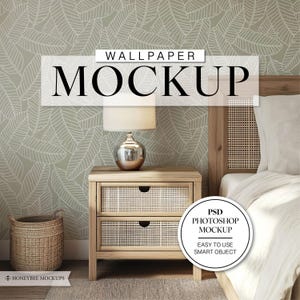 May include: A mockup of a bedroom interior with a green wallpaper featuring a white leaf pattern. The wallpaper is displayed on the wall behind a wooden nightstand with two drawers. A lamp with a white shade and a silver base sits on the nightstand. A wicker basket sits on the floor next to the nightstand. A white bed with a wooden headboard is in the background. The text "WALLPAPER MOCKUP" is displayed at the top of the image. The text "PSD PHOTOSHOP MOCKUP" is displayed in a circle at the bottom right of the image. The text "EASY TO USE SMART OBJECT" is displayed below the circle.