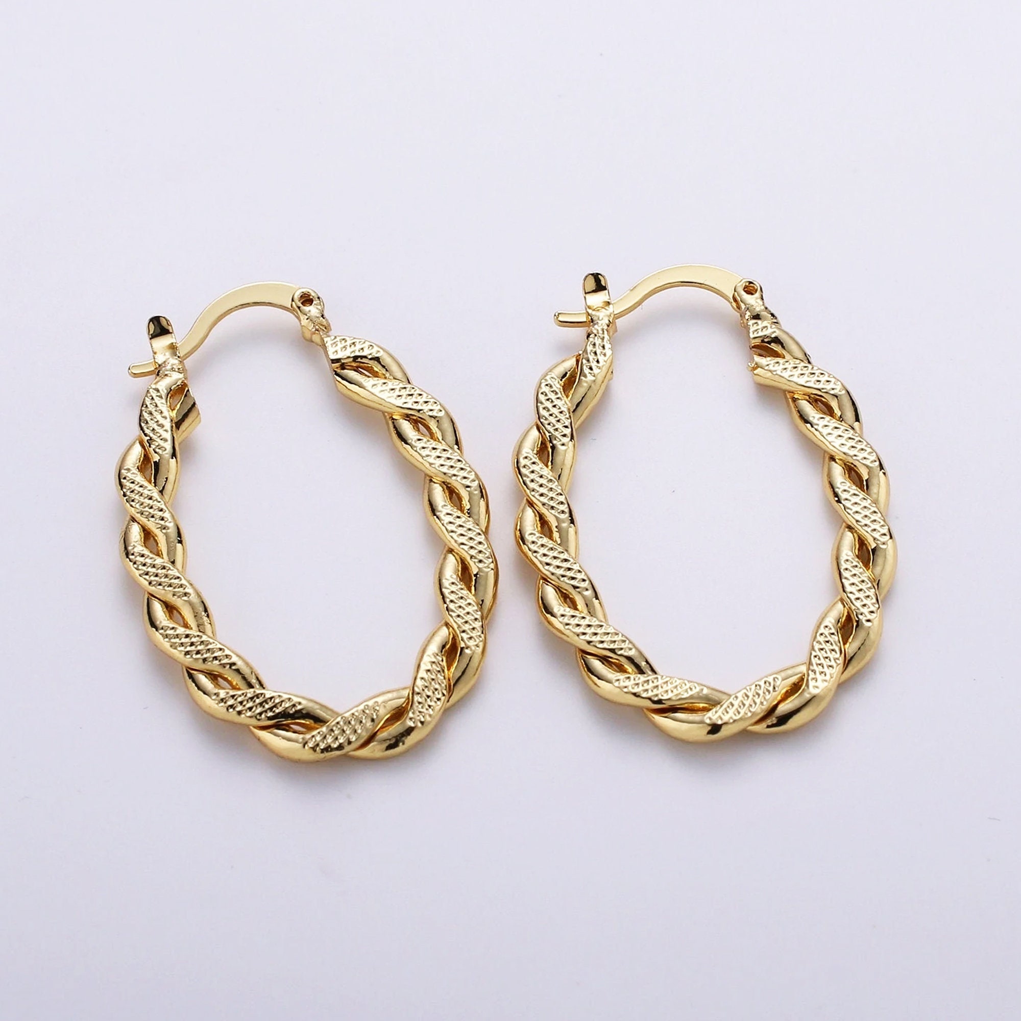 Twisted oval hoop earrings deals