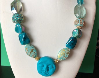 Turquoise and Gold Necklace with Moon Face and Leaf clasp. Acrylic,metal,polymer clay.