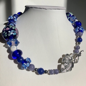 161/2 Choker made with stainless steel, lapis lazuli, torch fired beads. Cobalt blue and lavender tones. Metal leaf clasp image 1