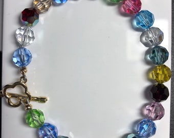 Genuine Swarovski 6mm and 8mm Crystal  Bracelet With Gold Filled Clasp.Peridot,sapphire,amythyst,aurora borealis.