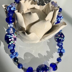 161/2 Choker made with stainless steel, lapis lazuli, torch fired beads. Cobalt blue and lavender tones. Metal leaf clasp image 5