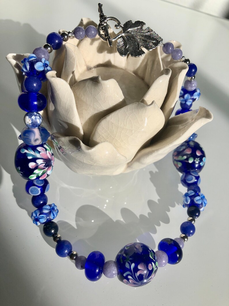 161/2 Choker made with stainless steel, lapis lazuli, torch fired beads. Cobalt blue and lavender tones. Metal leaf clasp image 5
