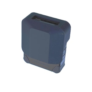 May include: A dark blue electronic device with a rectangular shape and rounded corners. The top has a slot and the word "MUTE" is visible. The device has a textured surface and a black base.