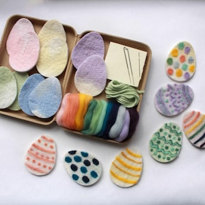 May include: A craft kit for making felt Easter eggs. The kit includes felt shapes, embroidery floss, needles, and instructions. The felt shapes are in various colors, including pink, blue, green, and yellow. The finished eggs are decorated with different patterns, including polka dots, stripes, and flowers.