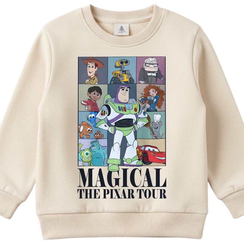 A beige sweater with a graphic design featuring characters from the animated film "Pixar's Magical The Pilar Tour".