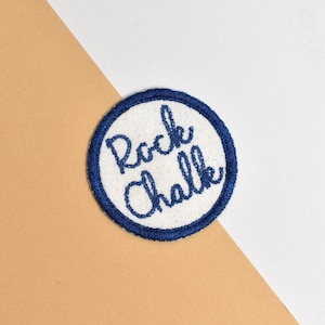 University of Kansas Rock Chalk Round Iron On Patch Blue and White Shimmer
