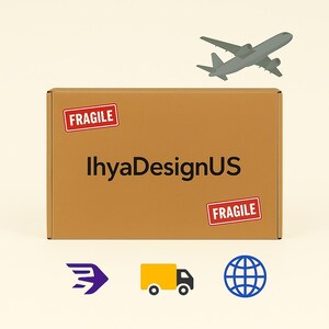 May include: A rectangular brown cardboard shipping box with the text IhyaDesignUS printed in black. Two red rectangular labels with the white text FRAGILE are attached. Above the box is a gray airplane, and below are purple, yellow, and blue icons.