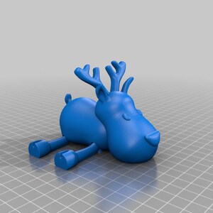 May include: A blue cartoon reindeer figurine with large antlers, small ears, and stubby legs. The reindeer is lying down, with its legs extended. The figurine has a smooth, matte finish and is set against a neutral background.