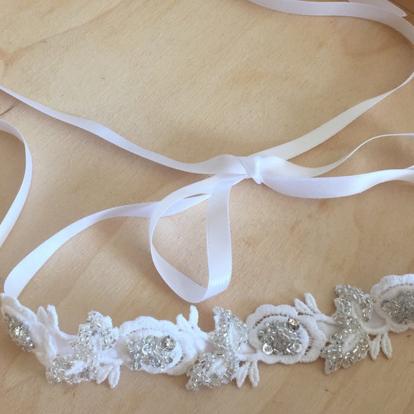 White Lace Bridal Headband/Headpiece. One of a kind hand beaded silver and lace headband with white satin ribbon tie.