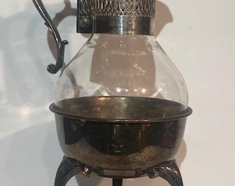 vintage silver-plated and glass coffee carafe with a warming stand