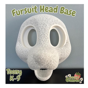 May include: A white fursuit head base with large eye openings and a prominent snout. The text "Fursuit Head Base" is arched above the head, with "Toony K-9" below. The Nelly's Garden logo is in the lower right corner.