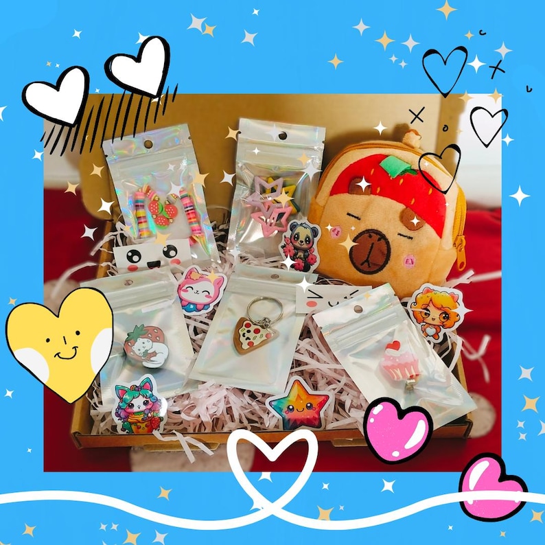 May include: A box filled with various colorful accessories, including stickers, keychains, and a small backpack. The items feature cute designs like strawberries, cats, and stars. The background is a vibrant blue with heart and star decorations.