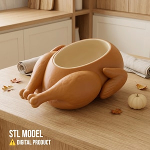 May include: A brown, hollow, roasted turkey-shaped bowl with a smooth, matte finish and a cream-coloured interior. The digital product is labelled as an STL model, designed for 3D printing, featuring the distinct shape of a whole cooked bird.