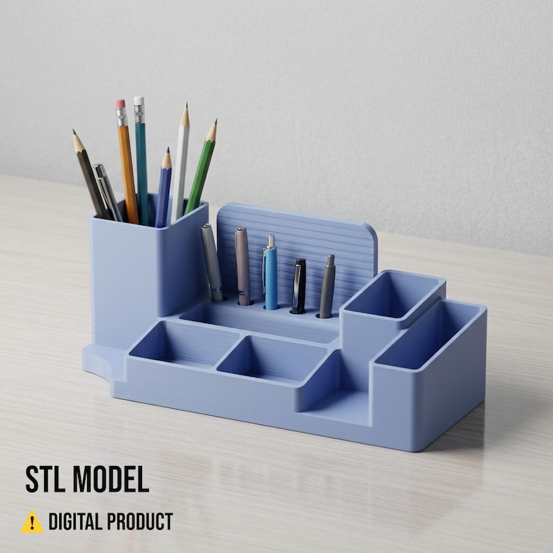 May include: A light blue desk organizer with multiple compartments for pens, pencils, and other office supplies. The organizer has a rectangular base with various sized cubbies and slots. The text "STL MODEL" and "DIGITAL PRODUCT" is visible.