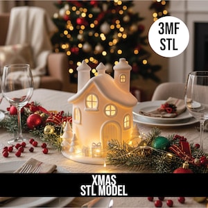 May include: A lit ceramic Christmas house with a snowy roof and windows, set on a table with festive decorations. The house has a door, chimneys, and the text "XMAS STL MODEL". A white circle with the text "3MF STL" is also visible.