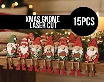 May include: A collection of 15 laser-cut Christmas gnomes with red hats, white beards, and green or red outfits. Each gnome has dangling legs with red boots. The text "XMAS GNOME LASER CUT" is displayed above the gnomes.