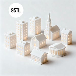 May include: A collection of white miniature buildings, including houses, skyscrapers, and a church, with illuminated windows. The buildings are arranged on a white surface. The text "9STL" is in a white circle in the upper left corner.