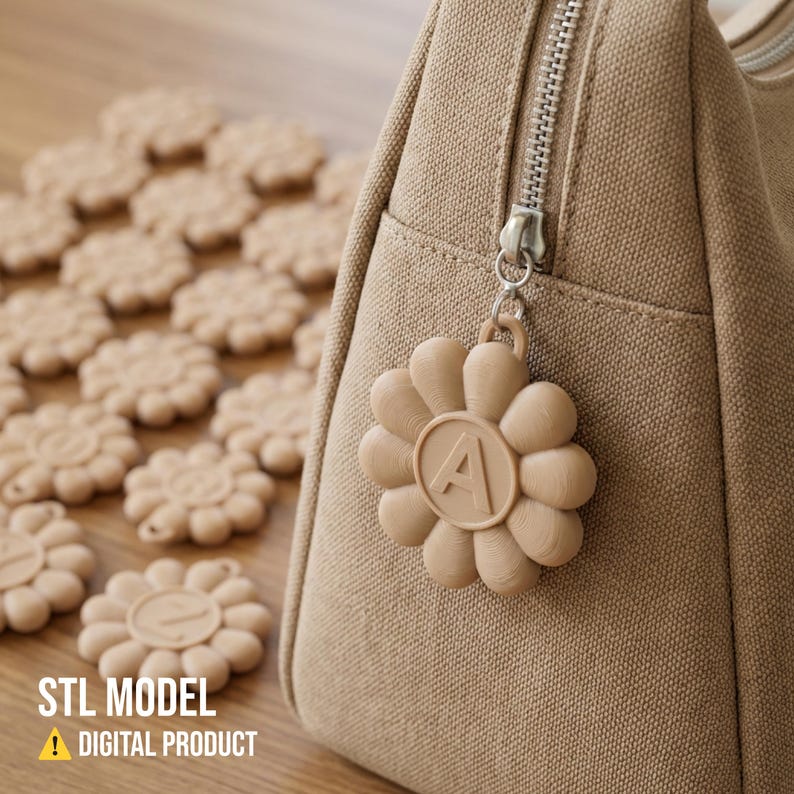 May include: A tan canvas bag with a silver zipper and a flower-shaped charm with the letter "A". Several flower-shaped objects are scattered on a wooden surface. The text "STL MODEL" and "DIGITAL PRODUCT" are visible.
