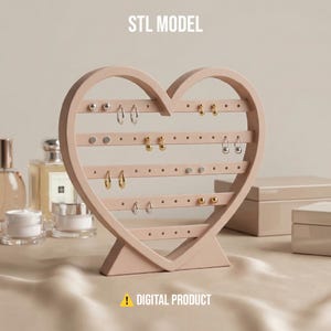 May include: A pink heart-shaped earring holder with multiple horizontal bars and small holes for displaying earrings. The text "STL MODEL" is at the top, and "DIGITAL PRODUCT" is at the bottom. Various earrings are displayed on the holder.