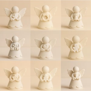May include: Nine ivory-colored angel figurines with different objects. Each angel has wings and a scalloped skirt. The angels hold a star, wreath, bell, snowflake, heart, gingerbread man, star, Christmas tree, and a bell.