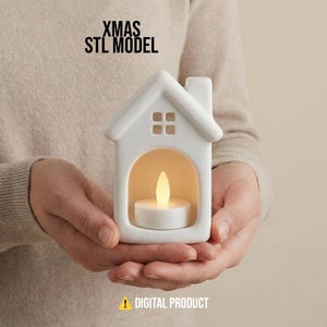 May include: A white ceramic house-shaped candle holder with a lit LED candle inside. The holder has a chimney and a window with four squares. The text "XMAS STL MODEL" is at the top, and "DIGITAL PRODUCT" is at the bottom.