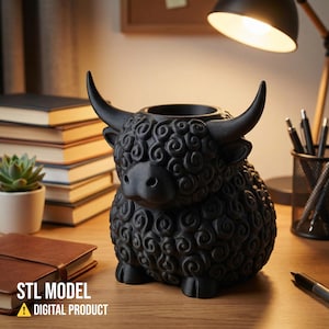 May include: A black Highland cow-shaped planter or pen holder. The sculpture has a textured, curly coat, horns, and a round opening at the top. The text "STL MODEL" and "DIGITAL PRODUCT" are at the bottom. The item is on a wooden desk.