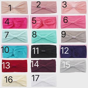May include: A collection of seventeen headbands in various colors, including pink, blue, black, and white. Each headband features a knotted bow design. Numbers 1 through 17 are printed on each headband.