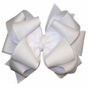 May include: A large white bow made from grosgrain ribbon. The bow is tied in a classic style with a center loop.