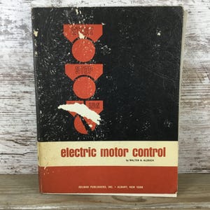 May include: Vintage book titled "electric motor control" by Walter N. Alerich. The cover is black with red and white graphics of "START", "STOP", and "RUN" symbols. The book's title is in white, and the publisher's information is at the bottom.