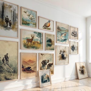 May include: A gallery wall of framed art prints showcasing wildlife and nature. The prints depict deer, birds, bears, dogs, and landscapes, rendered in a vintage watercolour style. The frames are a light wood colour.