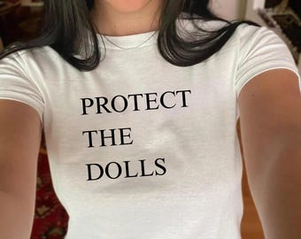 Protect The Dolls Baby Tee | Y2K 90s Aesthetic Shirt | Gender Equality Shirt | Pride Baby Tee | Human Rights Activist Shirt | Feminist Tee