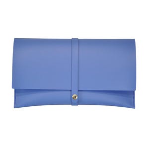 May include: A light blue clutch with a flap closure and a strap that secures with a gold-colored button. The clutch is made of a smooth material and has a simple, elegant design. The bag is a stylish accessory.