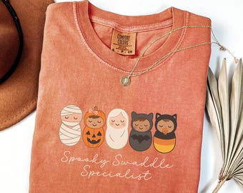 Camiseta de Halloween de la UCIN con diseño de especialista en pañales espeluznantes de Comfort Colors, regalo para la unidad de madres y bebés, camiseta de otoño, octubre, Halloween, camiseta de enfermera neonatal