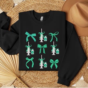 Nursing Coquette Sweatshirt Nurse Injectors St Patricks Day Nurse Aesthetics CRNA Green Bow Anesthesia Nursing Botox Nursing Anesthetist