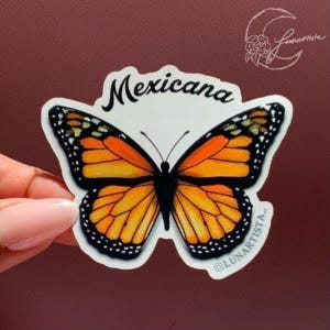 May include: A sticker featuring a monarch butterfly with orange and black wings. The word "Mexicana" is written in black cursive above the butterfly.