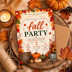 May include: A rectangular autumn party invitation card featuring a border of colourful seasonal leaves and string lights. The text reads: You're invited to our fall party, good company, great food, making memories together, Saturday October 25, 5:00 PM.