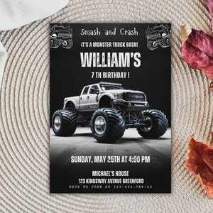 May include: A black birthday invitation card featuring a white monster truck graphic and the text: Smash and Crash, IT'S A MONSTER TRUCK BASH!, WILLIAM'S 7 TH BIRTHDAY!, SUNDAY, MAY 25TH AT 4:00 PM, MICHAEL'S HOUSE, 123 KINGSWAY AVENUE GREENFORD, RSVP TO JOHN AT 123-456-789-23.
