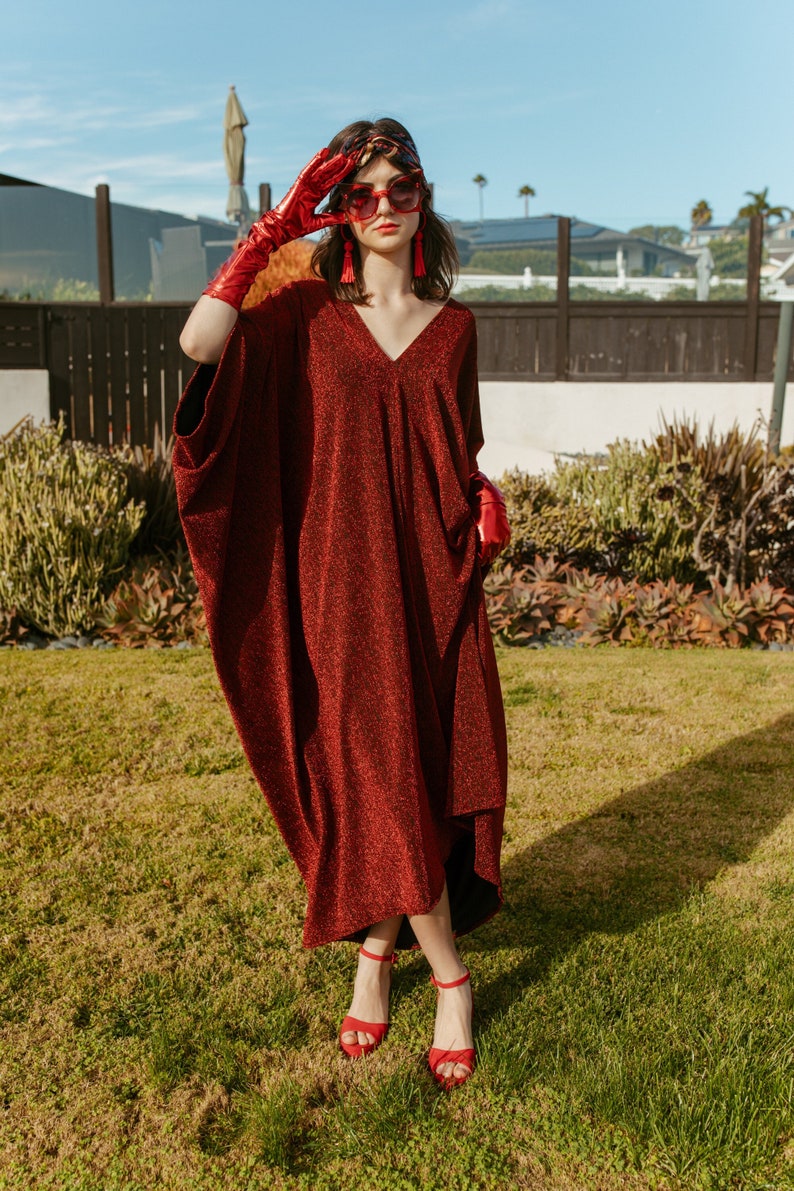 Shimmering crimson red caftan dress in champagne rose gold. Elegant bohemian in style.