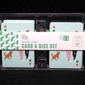 May include: A clear acrylic case with a deck of cards and dice. The cards have a light blue background with a graphic of two people walking dogs. The case has a label that reads "Acrylic Case Card & Dice Set".