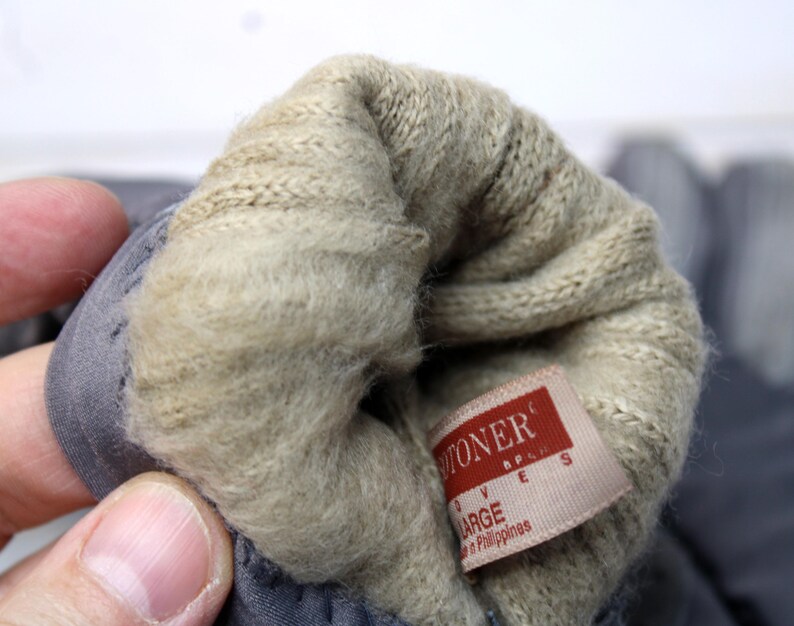 May include: A trio of ceramic mugs with a speckled, matte finish in cream, light grey, and dark grey. Each mug features a simple, minimalist design, ideal for tea or coffee.